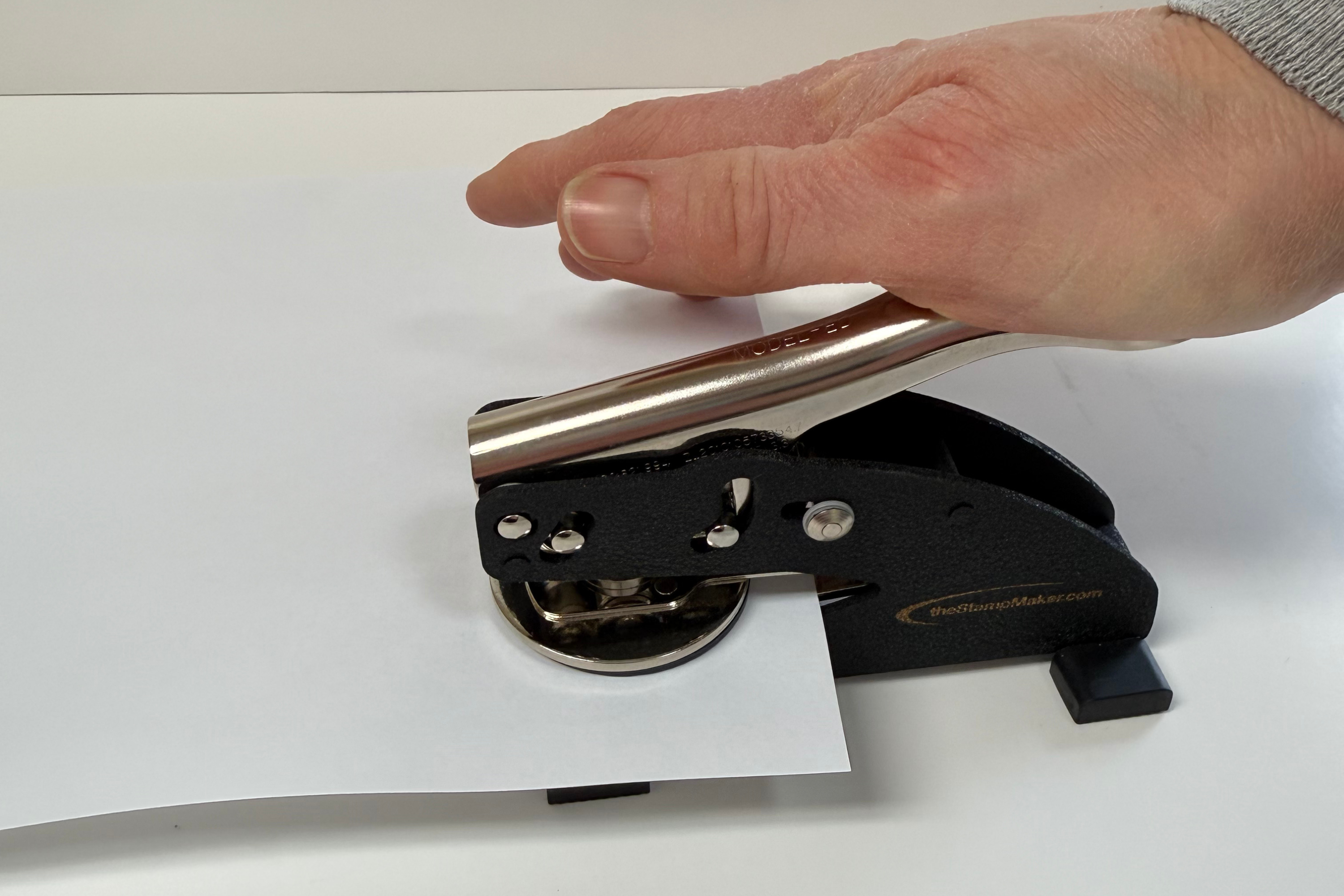 Release the embosser handle